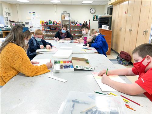 students work on art while they attend after school program