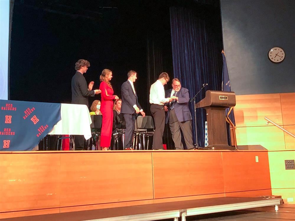 image of students on stage receiving awards