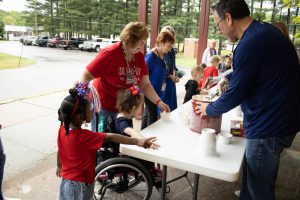 Ice cream party celebrating students 
earning over 10,000 Red Raider tickets!