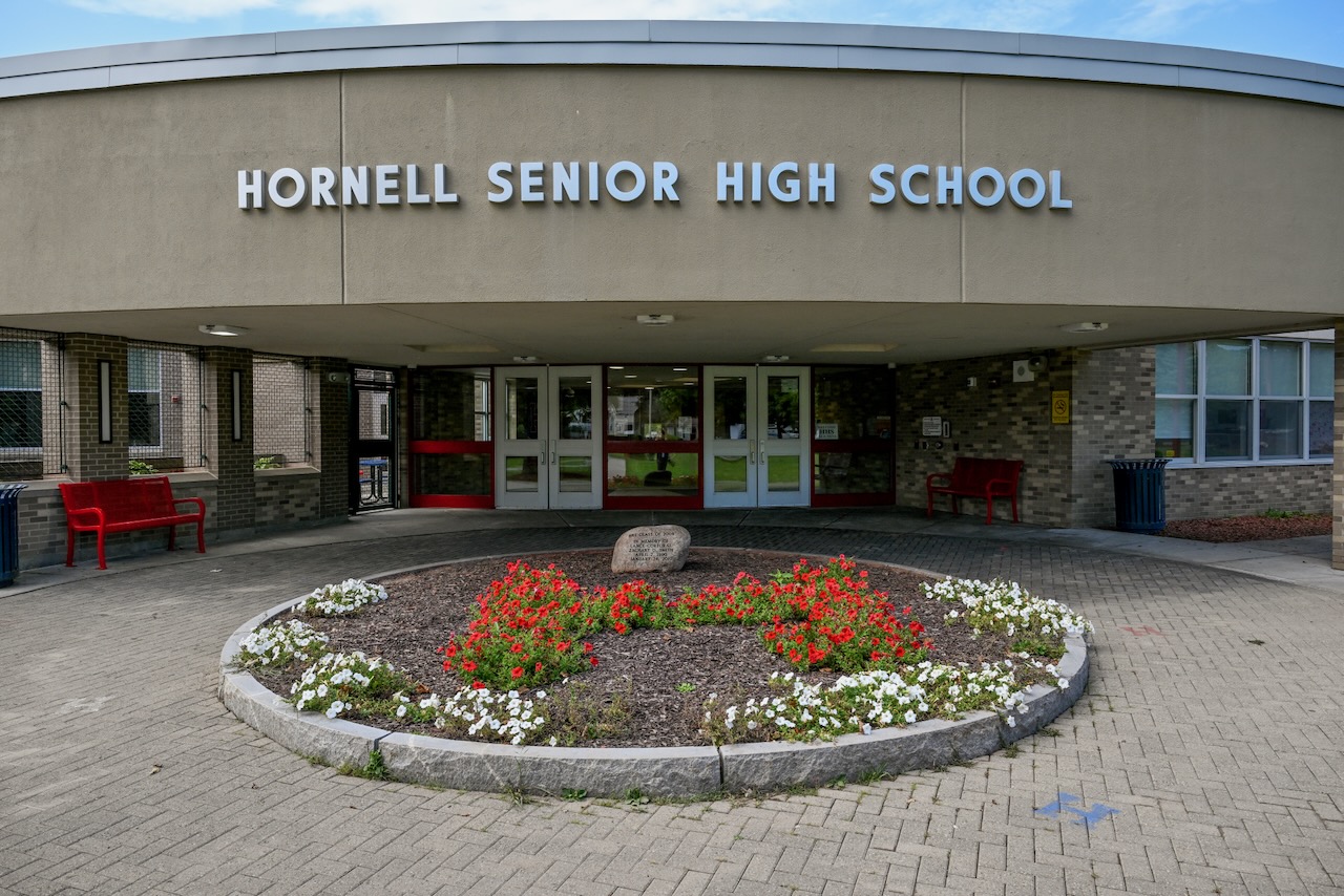 Seniors walking the High School Halls in their cap and gown