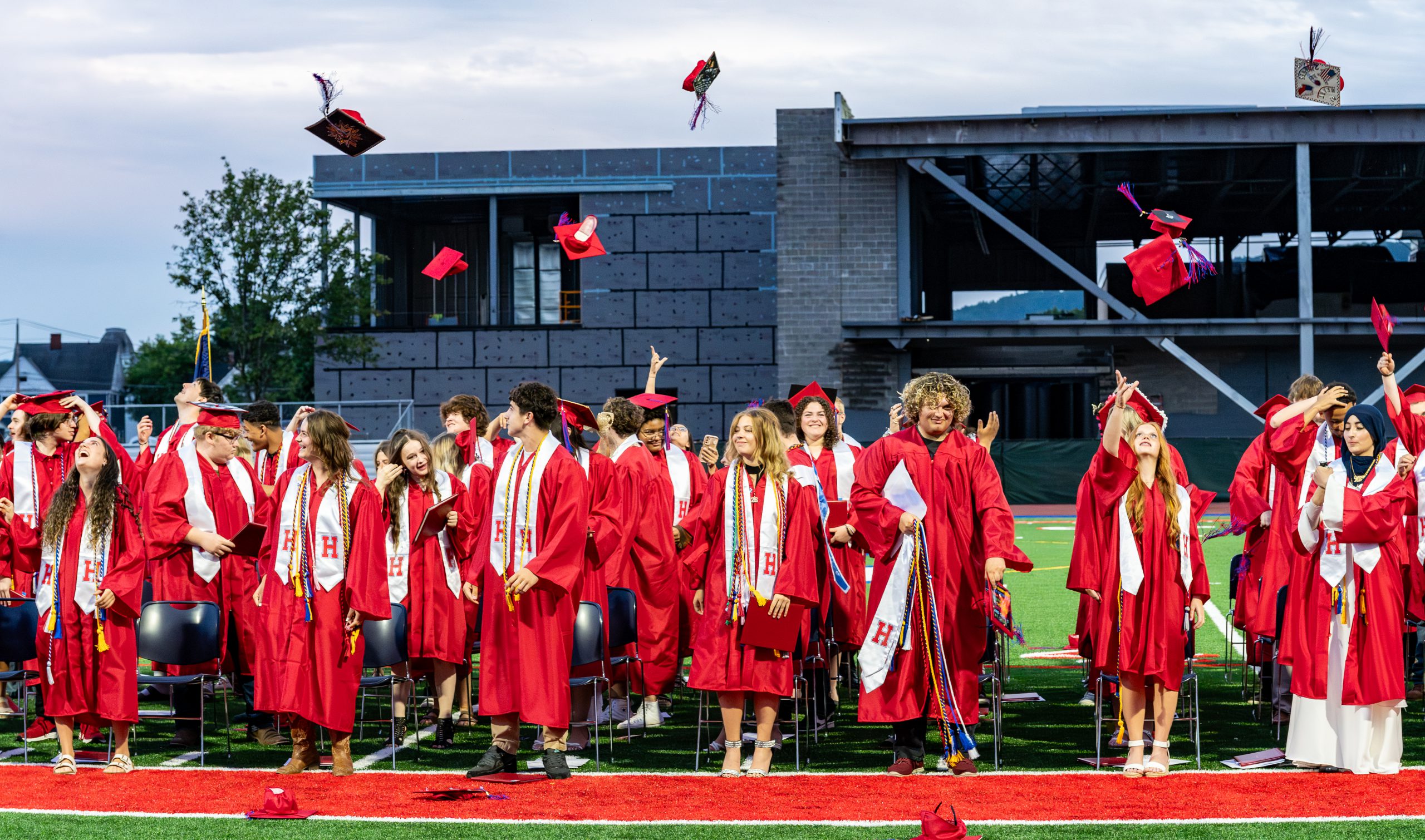 Graduates toss their caps